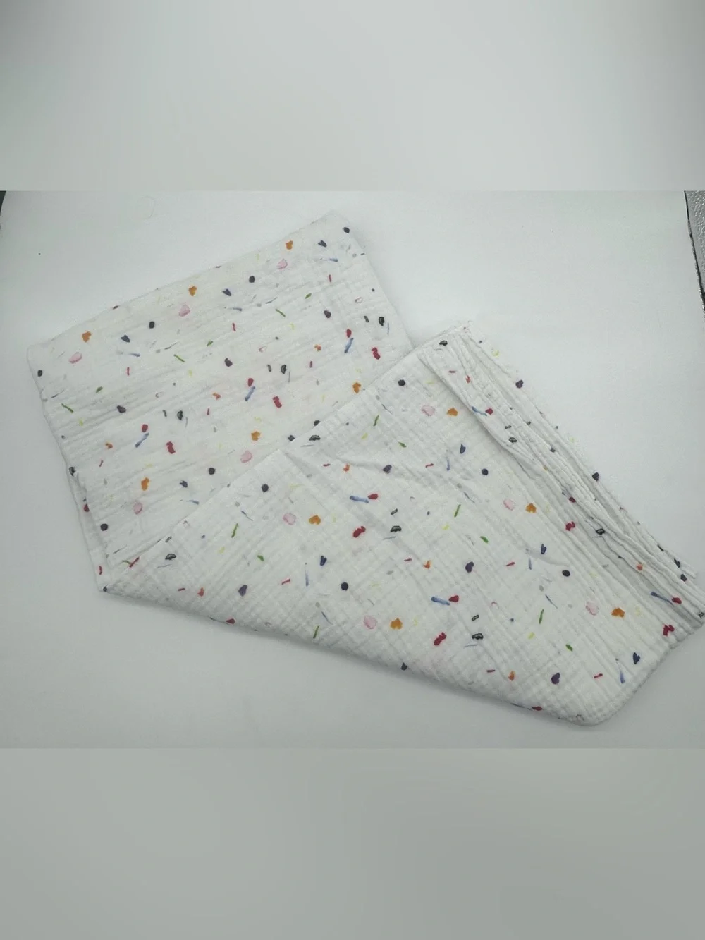 Lovevery Muslin Swaddle Blanket featuring Confetti Style Print